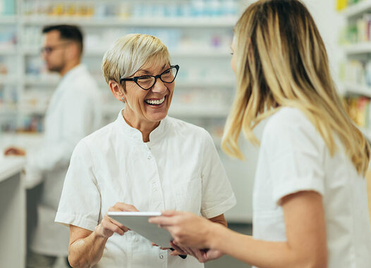 Pharmacists smiling on iPad